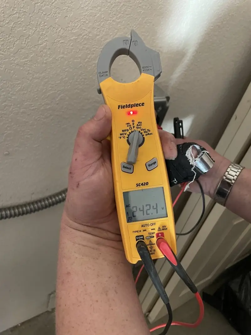 Voltage testing with clamp meter during Electrical Installation Services in Paw Paw